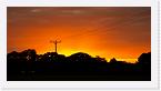 DSC3260 * The drive home presented me with a wonderful orange sunset, and as I had the camera with me, I couldn't resist stopping for a photo or two. This is taken somewhere between Rufforth and the A1237. * 3452 x 1800 * (875KB)