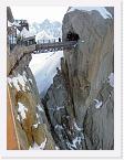 PICT3558 * The gantry from the top of the Aguille du Midi cable car to the Aguille du Midi itself. And skiers setting off for the Vallee Blanche in the background. * 2272 x 1704 * (1.87MB)